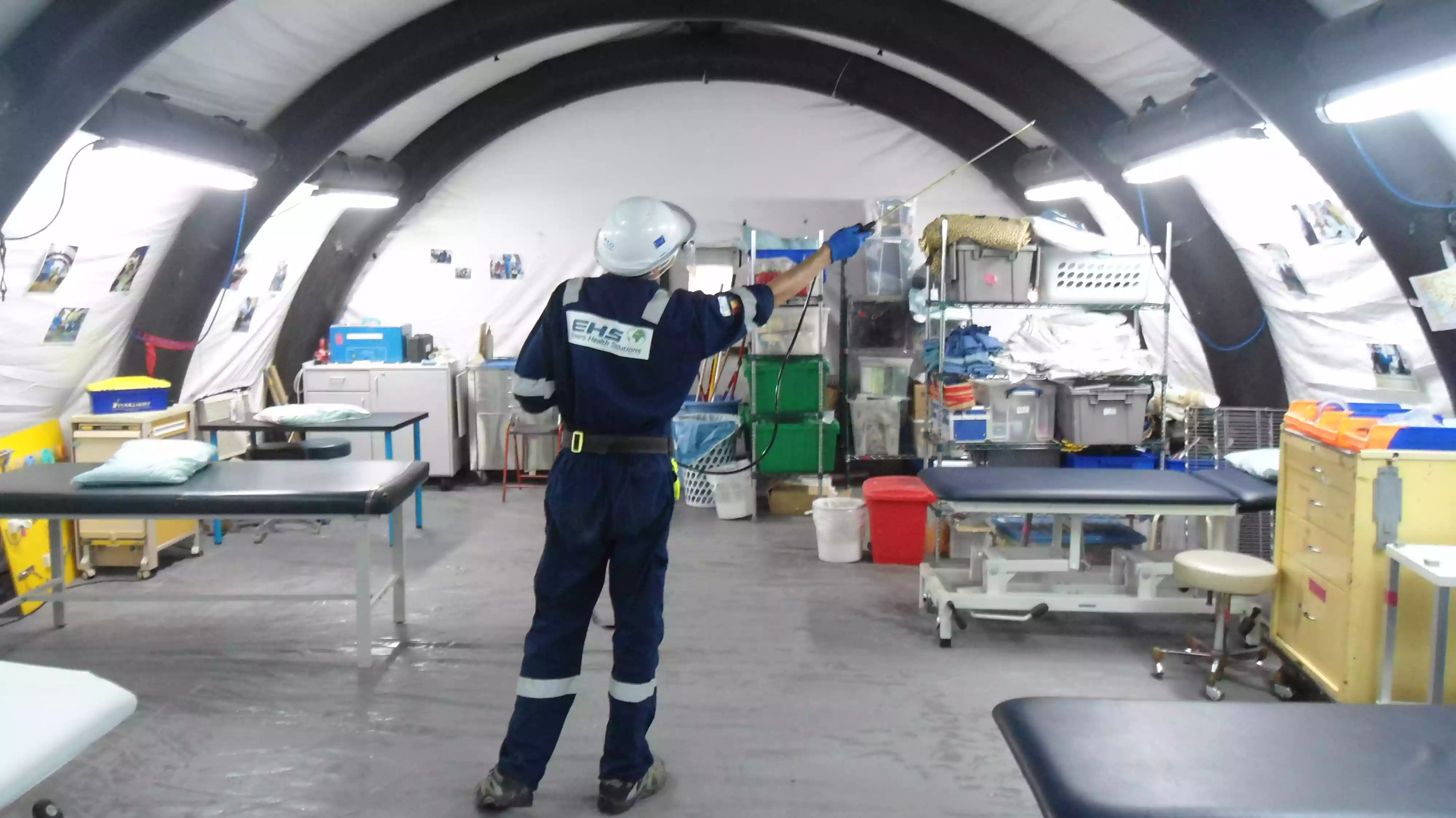 EHS worker performing service in medical room